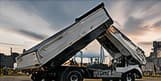 Truck with a raised tipper body